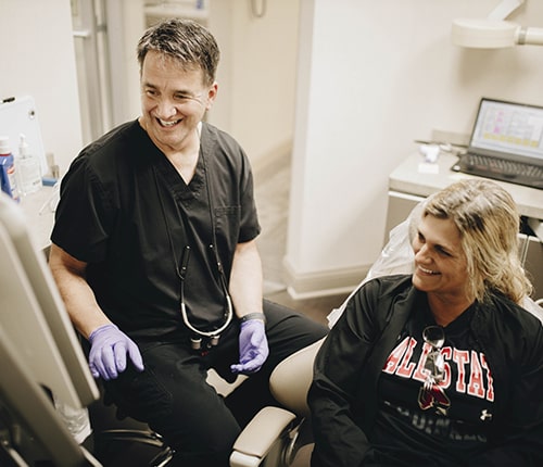 Dr. Pyle with a smiling patient at his Muncie, IN dental office