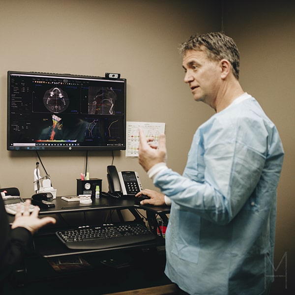 Dr. Pyle reviewing one of the TruDenta scans in the dental office